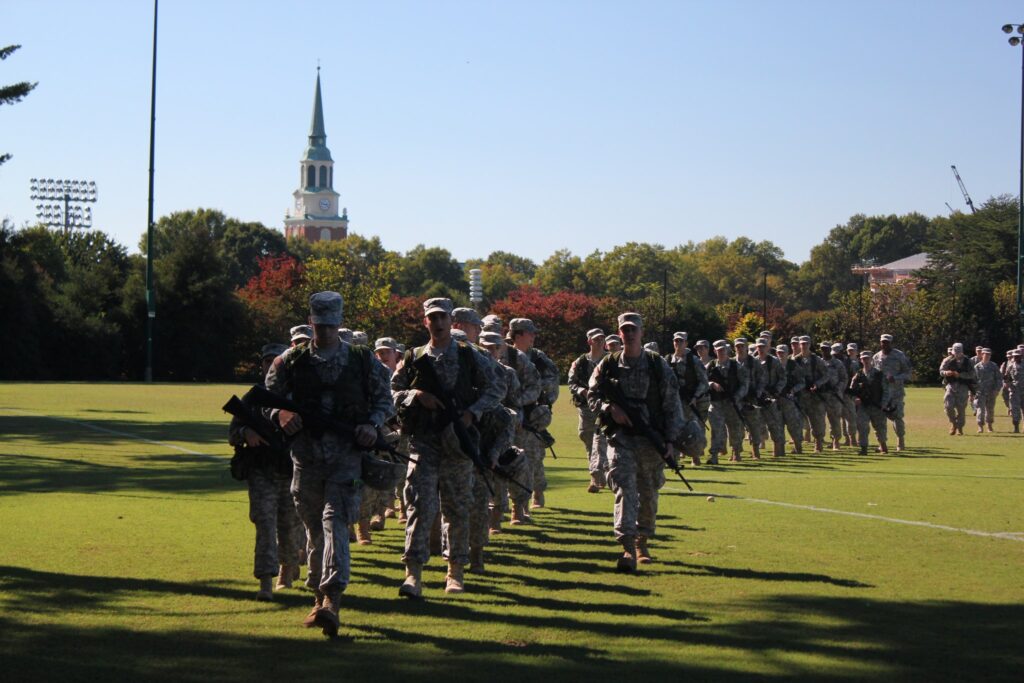 Wake Forest ROTC cadets marching with Wait Chapel in the background